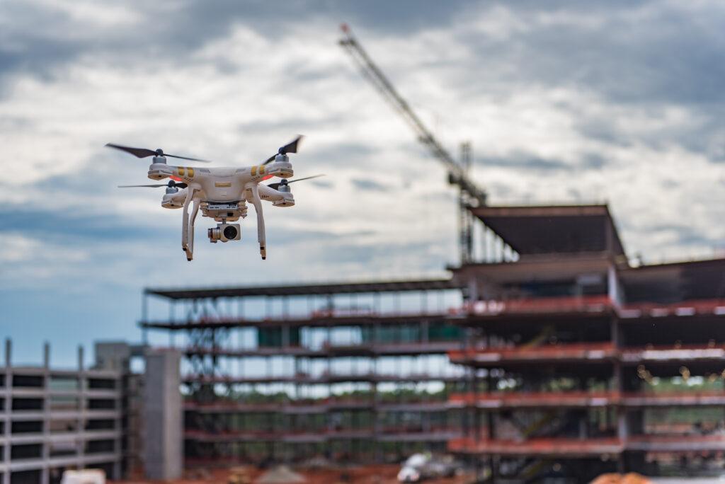 Drone flying above active construction job site
